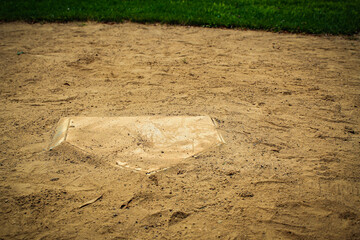 closeup of home plate on a baseball or softball field abstract sports background with copy space