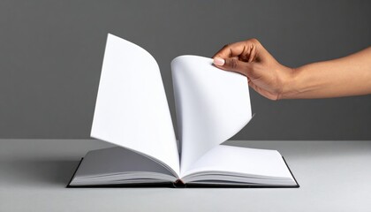 Hand Opening An Open Book With White Pages