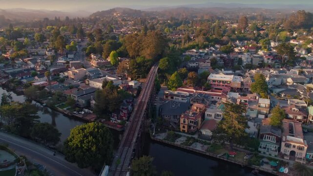 Aerial view of Capitola Village in California, USA. The image shows the residential area, the river, and the trestle bridge on a sunny day.