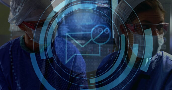 Standing female surgeons wearing masks, loupes and blue scrubs in operating room with HUD overlay