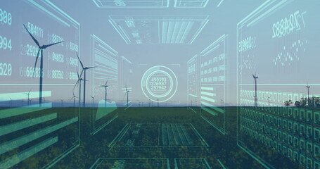 Floating holographic panels displaying data and charts on grassy plain at dusk, with wind turbines