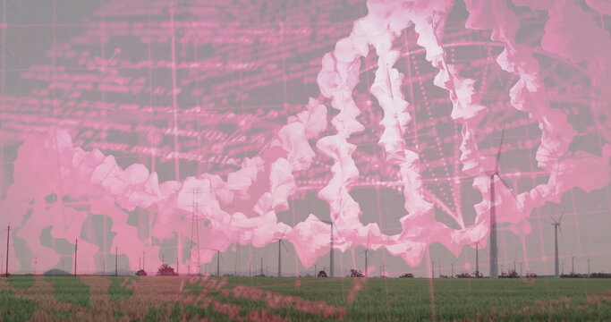 Spinning white wind turbines in rural farm field with lush grass, translucent pink DNA code overlay - Powered by Adobe