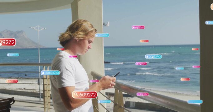 Leaning on railing man wearing white shirt checking smartphone on balcony, with floating labels - Powered by Adobe