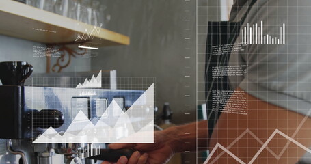 Operating aproned barista placing portafilter into espresso brewer at counter, charts, copy space