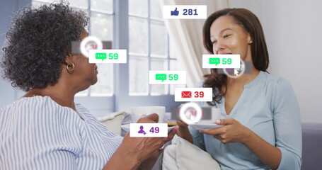 Sitting on sofa in living room, family members holding white coffee cups, with notification icons