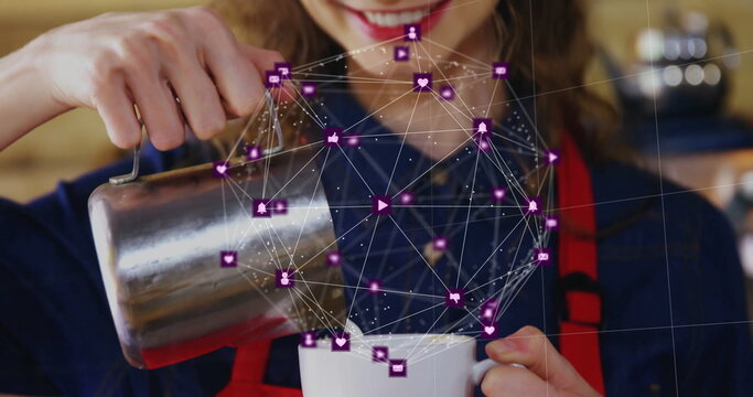 Barista wearing red apron pouring milk at cafe counter, with pitcher, mug and purple icon overlay