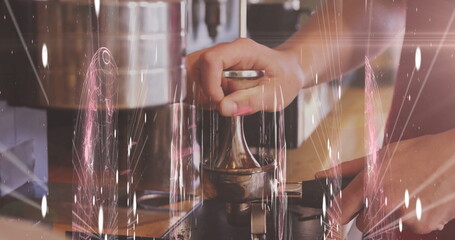 Pressing down barista hands tamping coffee grounds in portafilter at counter, with metal tamper