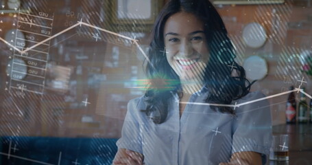 Standing woman wearing button-up blouse crossing arms in modern lounge, with floating data charts