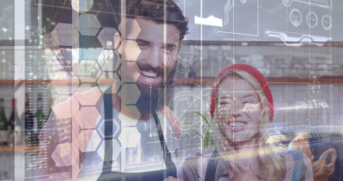Standing baristas wearing aprons at cafe counter, displaying bottles jars, UI overlays - Powered by Adobe