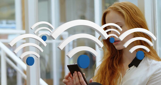 Red-haired commuter wearing white blouse using smartphone in train, with floating wireless icons