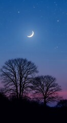 Serene crescent moon over silhouette trees against a twilight sky landscape