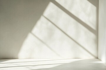 Sunlit Room Interior With White Wall and Diagonal Light Shadows