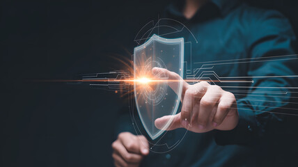 Businessman activates digital shield interface for enhanced cybersecurity protection