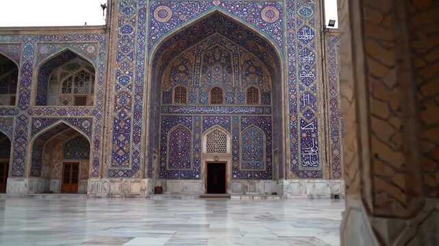 Intricate Tilework Pillars Framing Historical Persian Mosque with Isfahan, and Iran.