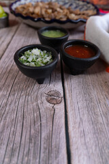 Various sauces and accompaniments for tacos, Mexican food