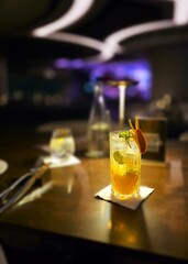 Orange Cocktail with Garnish on Bar Counter