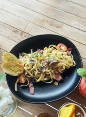 Linguine Carbonara with Garlic Bread on Plate