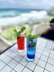 Refreshing Cocktails on a Tabletop by the Beach