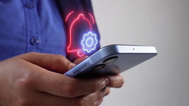 Setting up alerts and notifications. A business professional checking his mobile phone and a virtual bell and gear icon.
