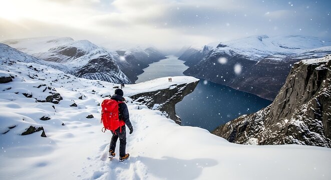 Hiker with Red Backpack in Snowy Norwegian Landscape at Trolltunga