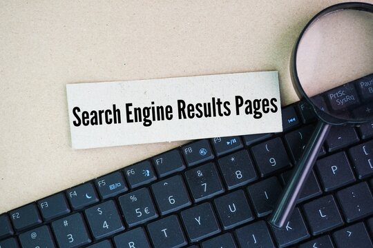 Laptop keyboard and magnifying glass with the words search engine results pages or SERP letters. It involves optimizing website content, structure, and other technical aspects to make it easier 