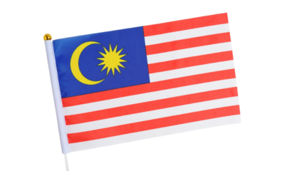 Close-up of a small Malaysian flag featuring the crescent moon and star emblem, available on transparent background