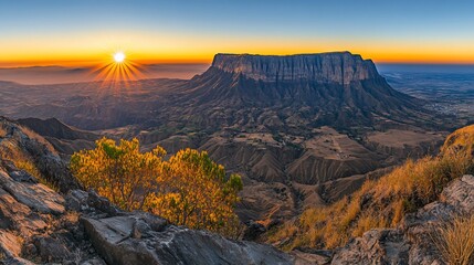 Obraz premium Majestic sunrise over a vast mountain range. Dramatic vista from a high peak