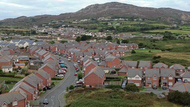 Holyhead homes aerial view overlooking peaceful early morning residential housing and Welsh mountain