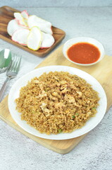 Delicious fried rice with egg, chilli, crackers and green onion, Indonesian dish.