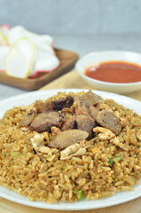 Delicious beef fried rice with egg, chilli, crackers and green onion, Indonesian dish.