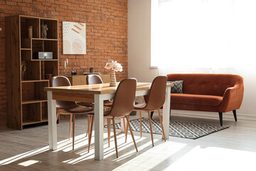 Living room in loft style with sofa, table and chairs