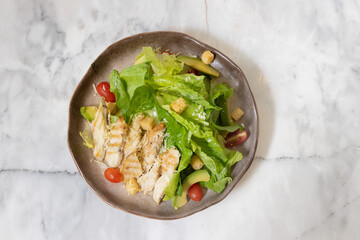 Fresh chicken and vegetable salad served on a plate