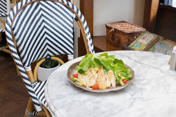 Fresh chicken and vegetable salad served on a plate