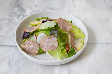 Fresh salad served in a glass bowl