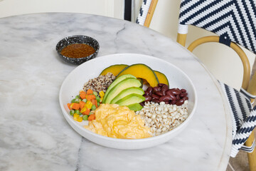Spices and herbs with rice and fresh vegetables on a table