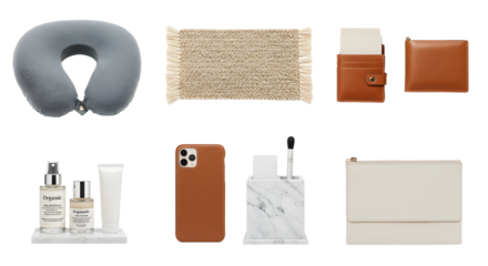 LIFESTYLE - Flat lay of travel and personal accessories including neck pillow, leather wallets, skincare products, smartphone case, and organizer on white background