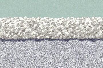 Light-gray and light-purple granular material, layered with a light-teal/mint top layer