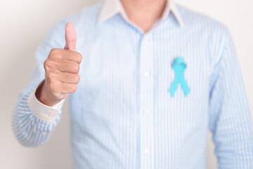 man with blue Ribbon for concept of blue November, November Prostate Cancer Awareness month, World...