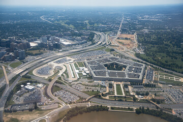 Aerial view of the Pentagon complex with surrounding roads, parking and greenery. g.