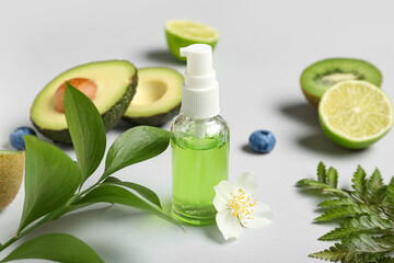 Bottle of natural cosmetics on grey background