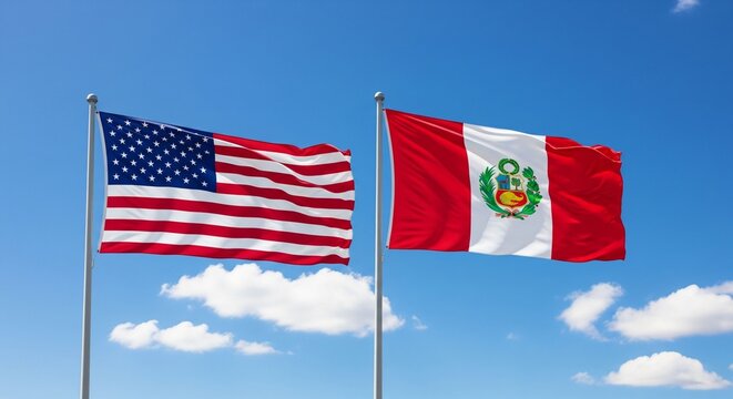 the national flags of the United States of America and Peru waving on flagpoles against a blue sky. 