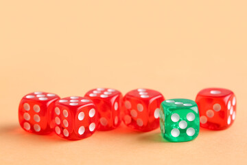 Different game dices on orange background
