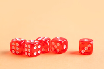 Red game dices on orange background