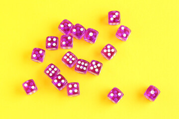 Purple game dices on yellow background