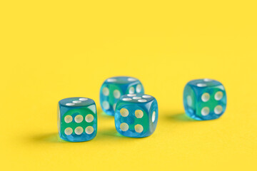 Blue game dices on yellow background