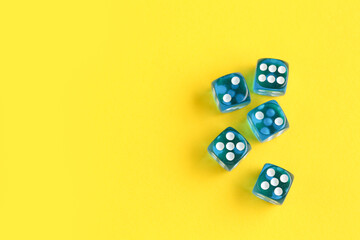 Blue game dices on yellow background