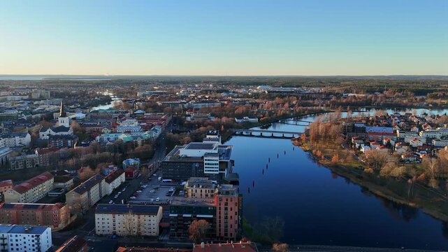 Scenic aerial panorama of Karlstad skyline showing the church bridges and winding rivers framed by a mix of modern and historic architecture 