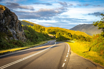 road through the highlands, scotland, mountains, during sunset, uk