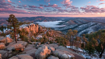 Mountain vista at dawn, frosted rocks and clouds