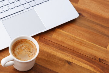 Laptop with cup of coffee
